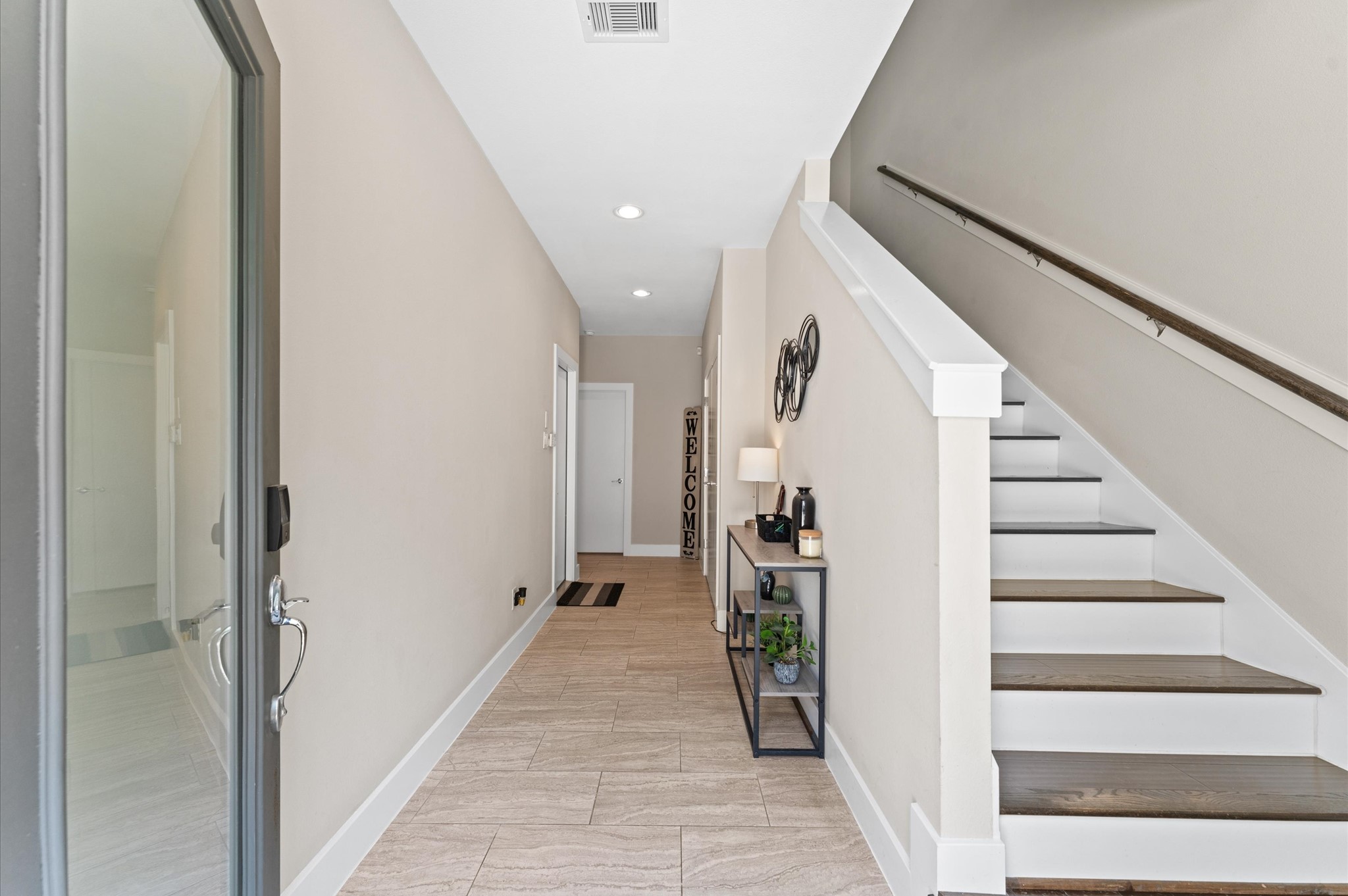 2422 Cochran Street Houston, TX 77009 - Photo 30 of 31 Step inside and note the high ceilings! Two bedrooms and a full bath are located on the first floor, while the primary suite is on the second floor. This is a great floor plan for multi-generational families and roommates.