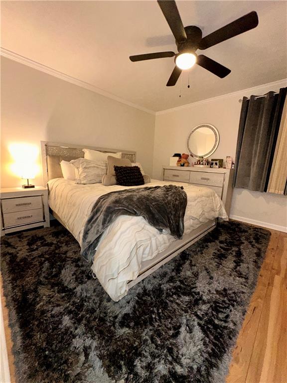 1625 Conley Road, Unit 143 Conley, GA 30288 - Photo 6 of 6 a bedroom with a bed and a chandelier