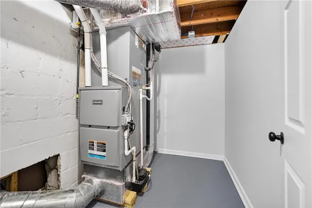 a view of kitchen with refrigerator microwave and cabinets