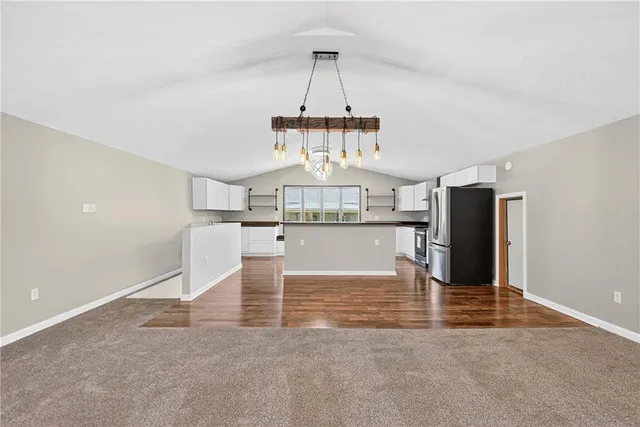 a kitchen with stainless steel appliances granite countertop a stove and a sink