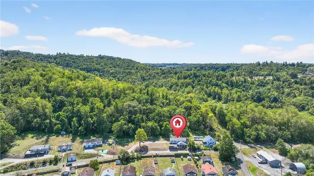 a view of a swimming pool and mountains in the background