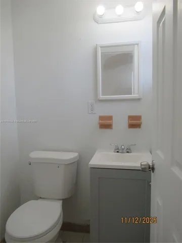 a white toilet sitting next to a bath tub shower