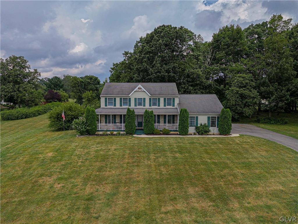 694 Bok Road Nazareth, PA 18064 - Photo 1 of 44 a front view of a house with a garden