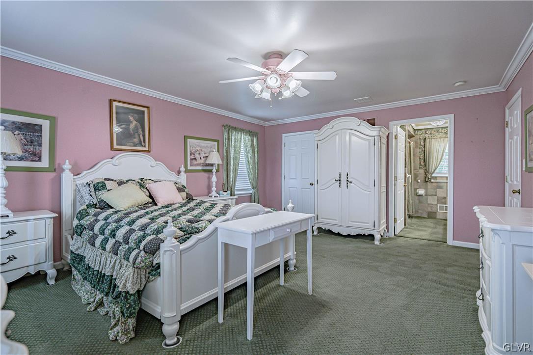 694 Bok Road Nazareth, PA 18064 - Photo 20 of 44 a bed room with a bed and a chandelier