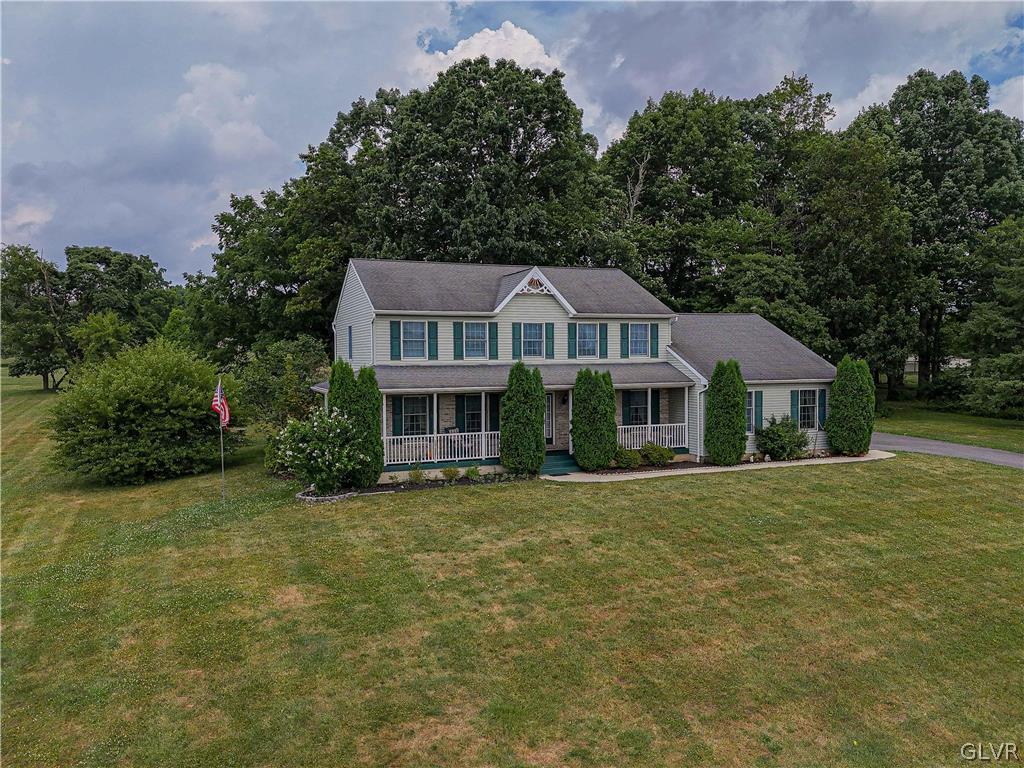 694 Bok Road Nazareth, PA 18064 - Photo 2 of 44 a front view of a house with a garden