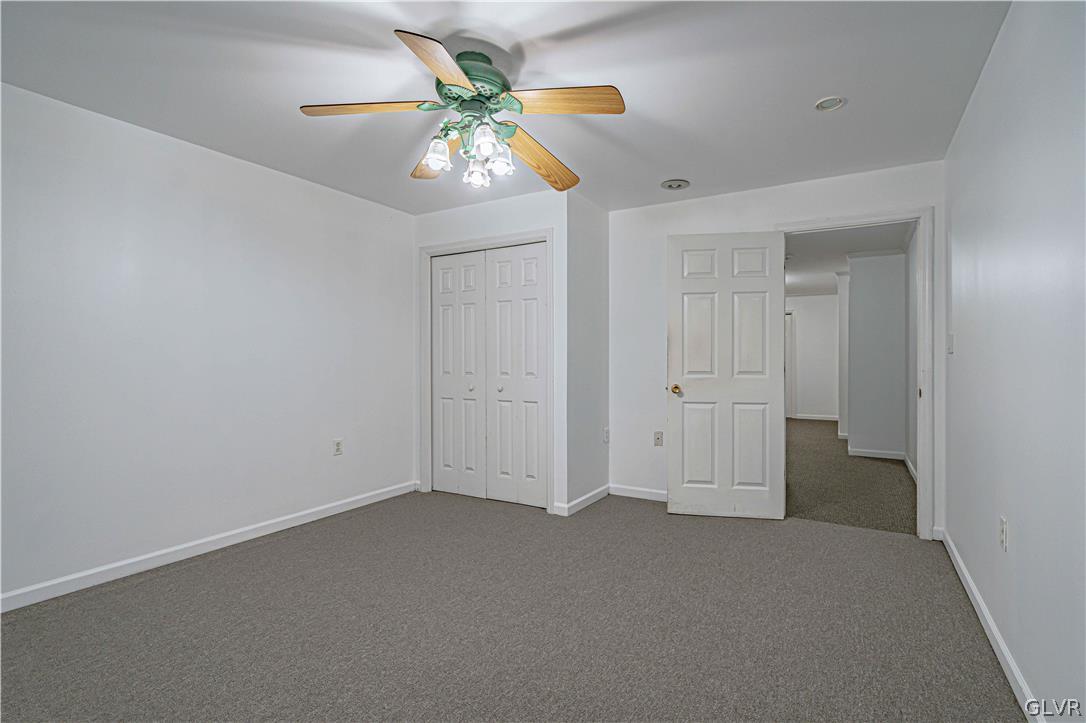 694 Bok Road Nazareth, PA 18064 - Photo 35 of 44 an empty room with chandelier fan and windows