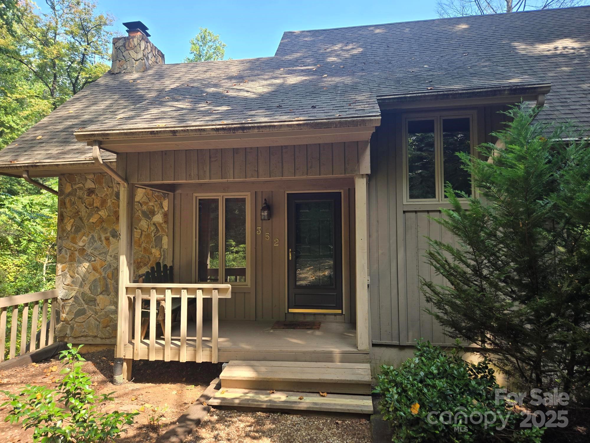352 Bolt Road Lake Lure, NC 28746 - Photo 1 of 31 a view of a house with a porch