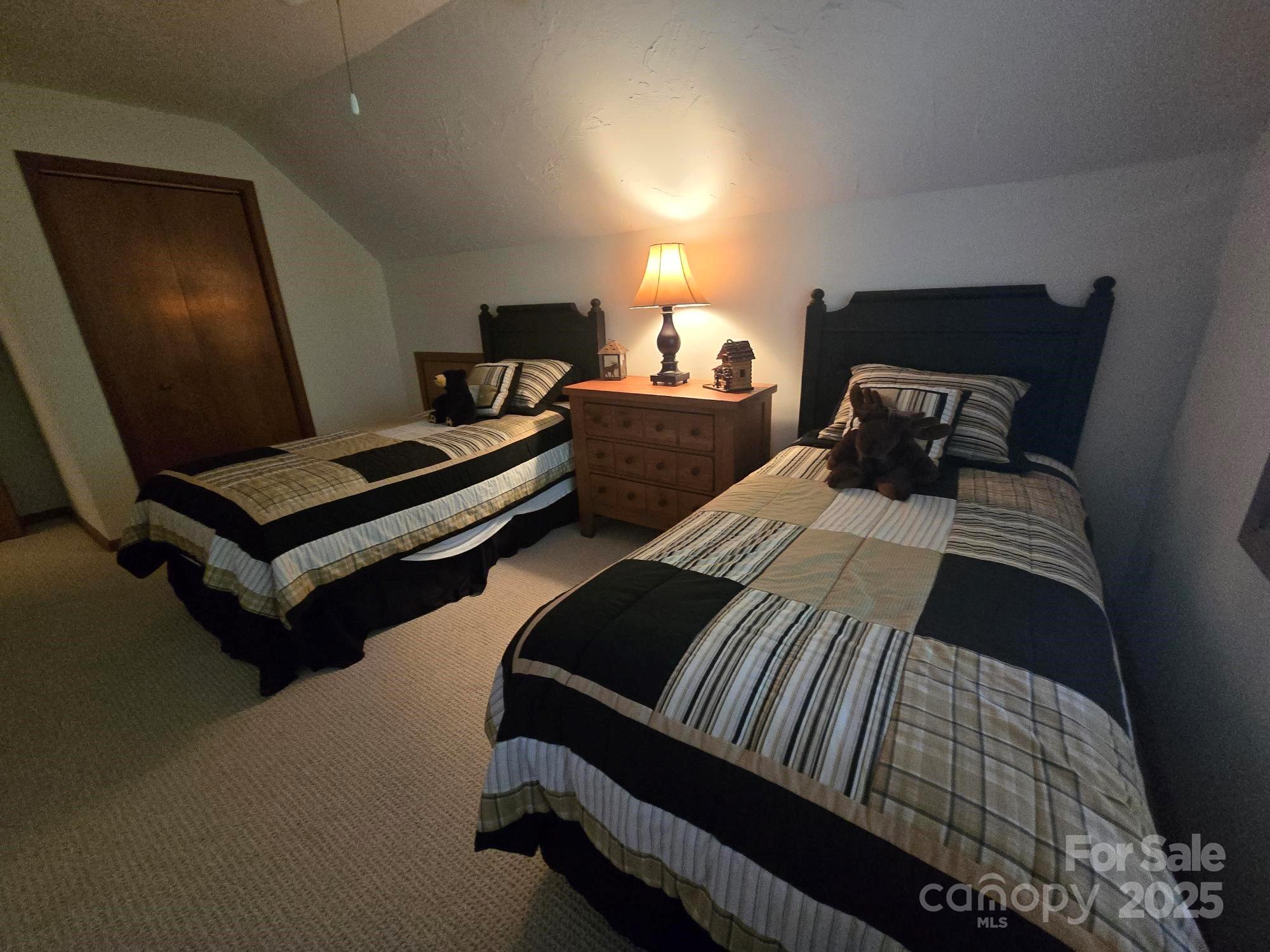 352 Bolt Road Lake Lure, NC 28746 - Photo 13 of 31 a bedroom with double bed and a window