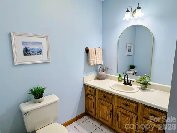 a living room with fireplace furniture and a flat screen tv