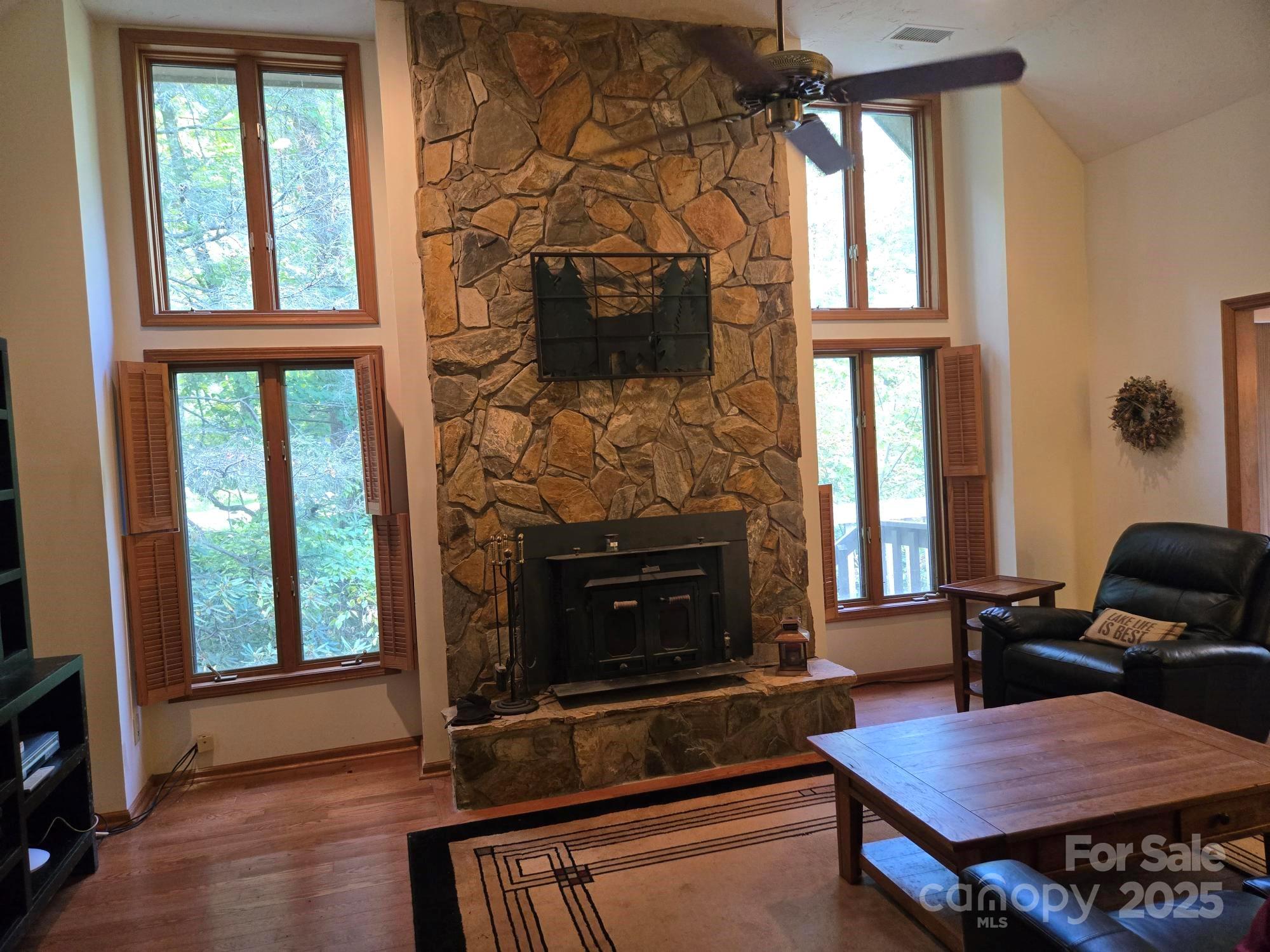 352 Bolt Road Lake Lure, NC 28746 - Photo 15 of 31 a living room with furniture fireplace and flat screen tv