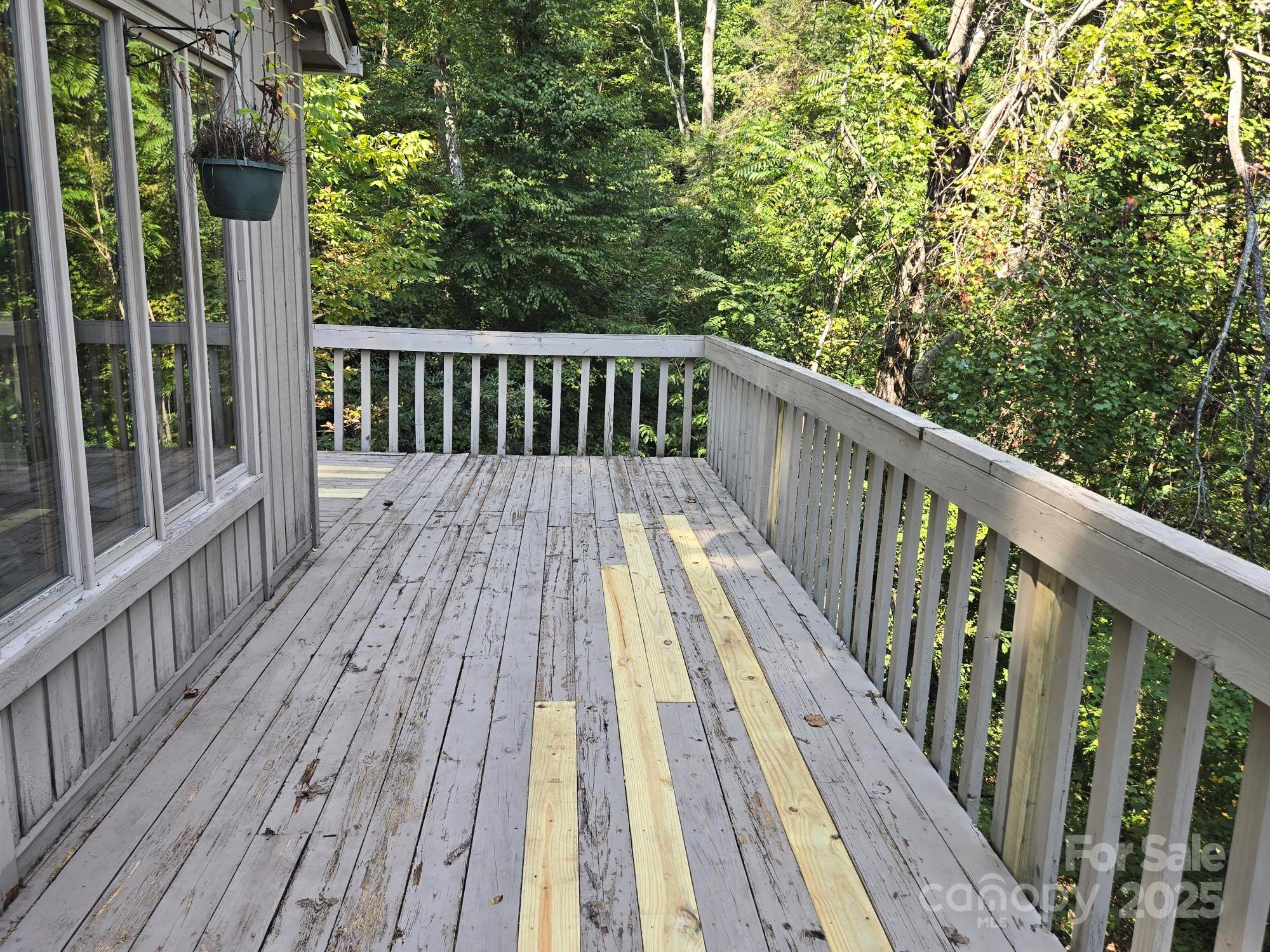 352 Bolt Road Lake Lure, NC 28746 - Photo 16 of 31 a view of balcony with wooden floor and fence