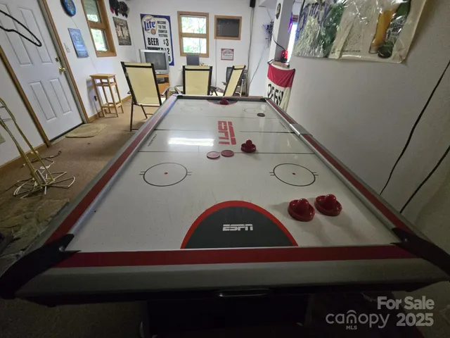 a view of kitchen furniture with wooden floor