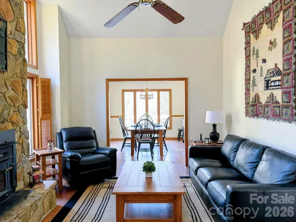 a bathroom with a granite countertop sink and a large mirror