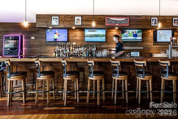 a utility room with a bed and a white table