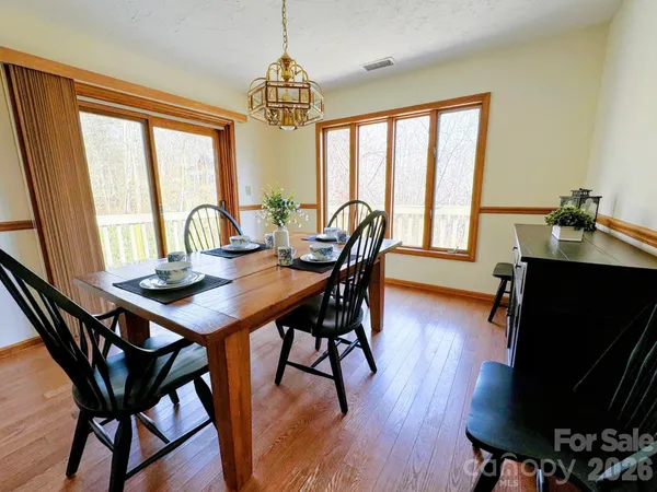 a kitchen with stainless steel appliances granite countertop a sink a stove top oven a counter space and cabinets