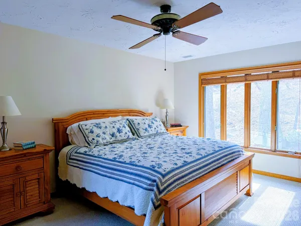 a bedroom with bed and window