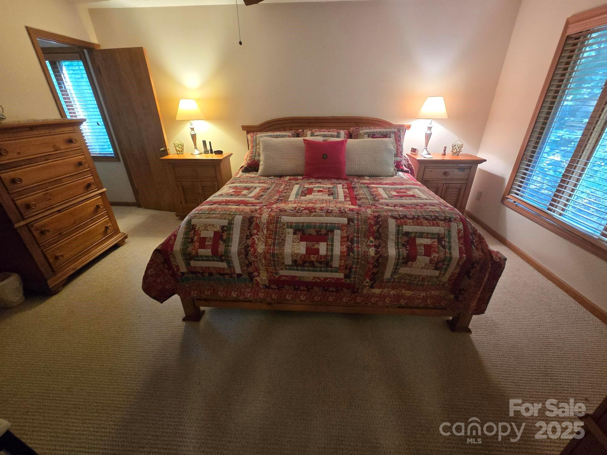 352 Bolt Road Lake Lure, NC 28746 - Photo 10 of 31 a bed sitting in a bedroom next to a window