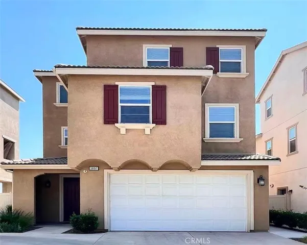 a front view of a house with large windows