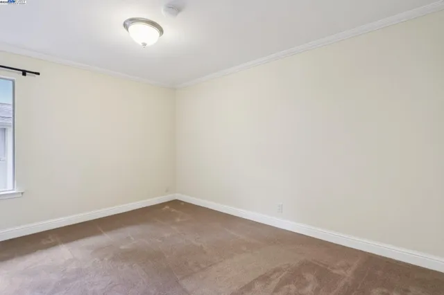 an empty room with a empty space and a window