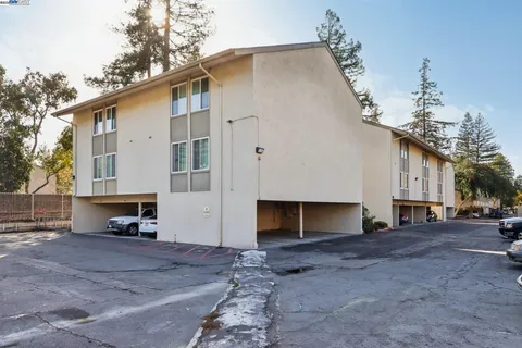 a view of a house with a yard and garage