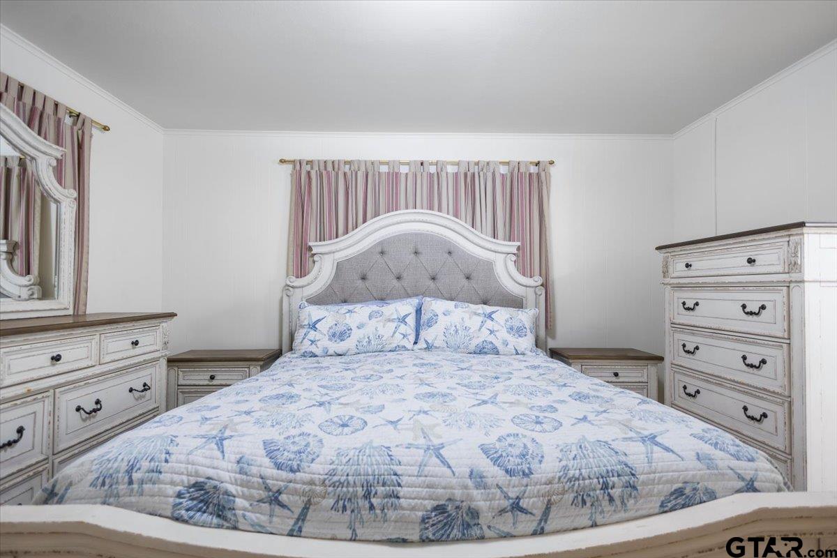 5357 Farm To Market Road 2087 Longview, TX 75603 - Photo 17 of 39 a bedroom with a bed and a dresser