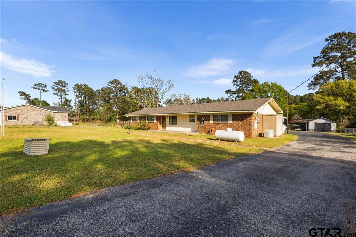 5357 Farm To Market Road 2087 Longview, TX 75603 - Photo 2 of 39 a front view of a house with a big yard