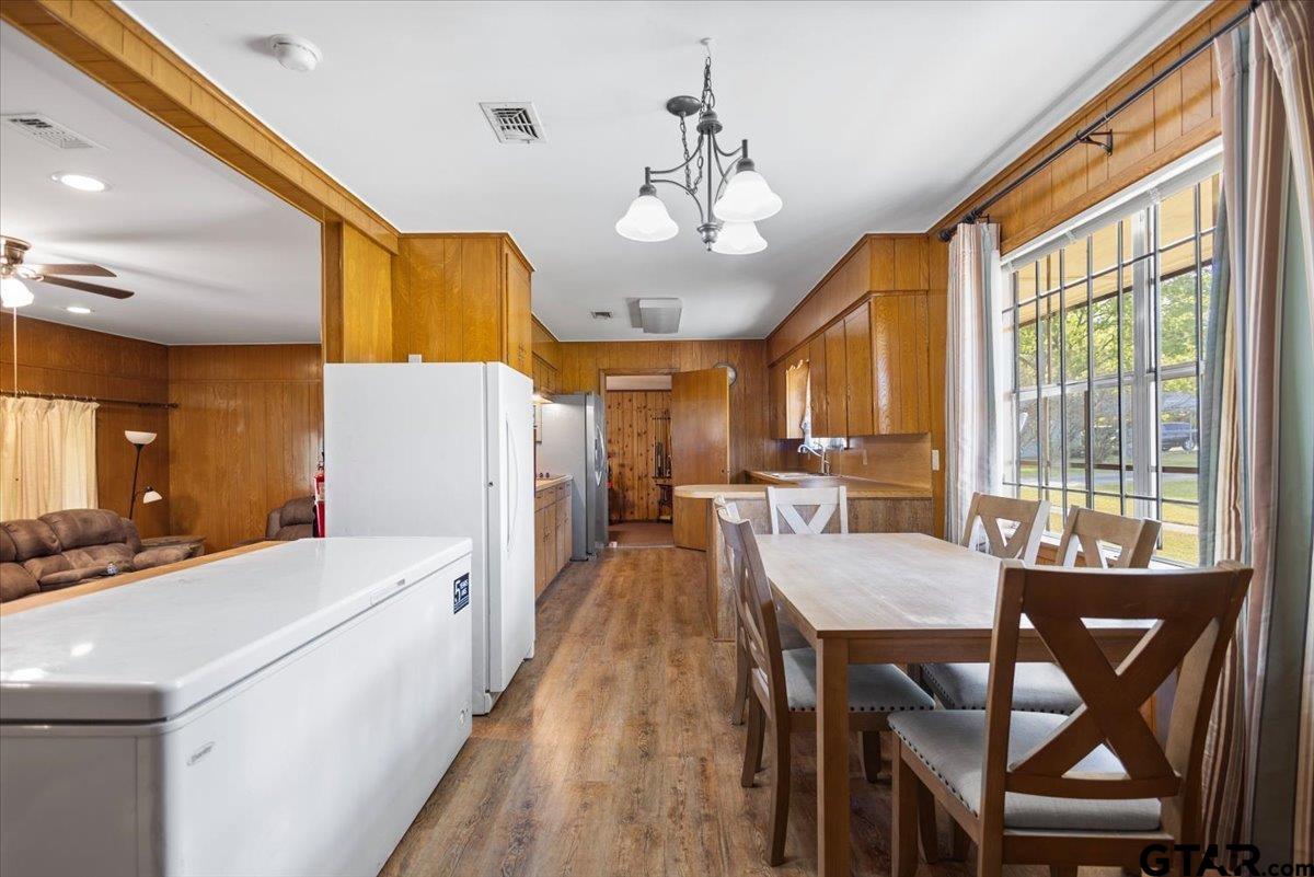 5357 Farm To Market Road 2087 Longview, TX 75603 - Photo 24 of 39 a dining room with stainless steel appliances kitchen island granite countertop furniture and a large window