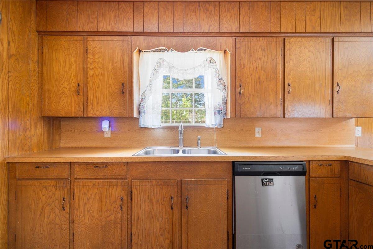 5357 Farm To Market Road 2087 Longview, TX 75603 - Photo 27 of 39 a kitchen with stainless steel appliances granite countertop a sink a cabinets and a window