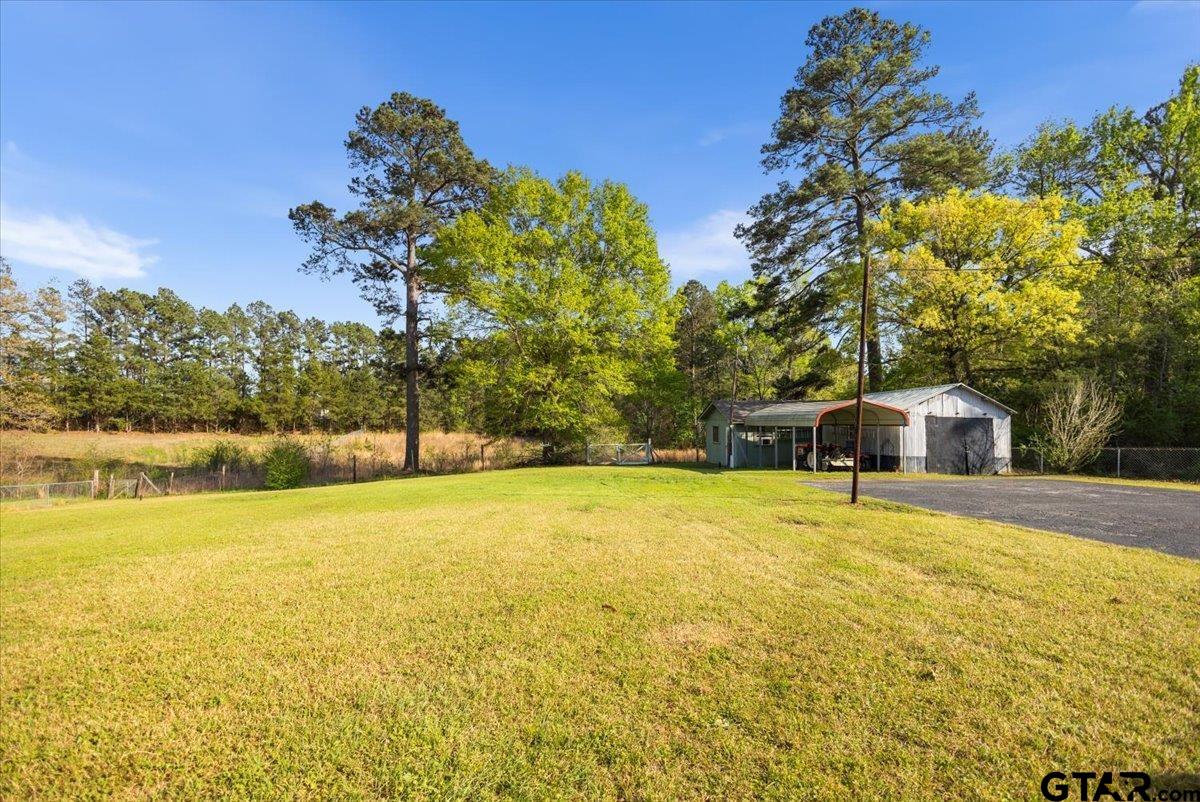 5357 Farm To Market Road 2087 Longview, TX 75603 - Photo 33 of 39 a view of a large body of water with a house in the background