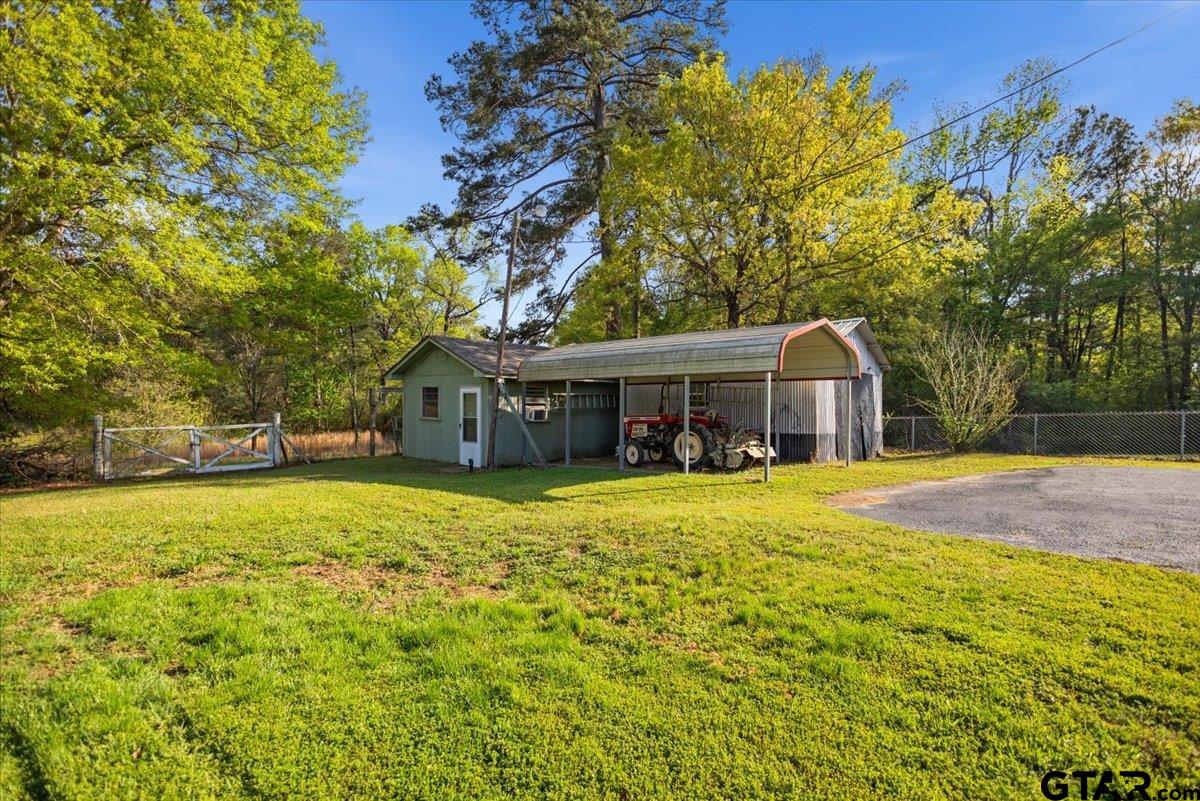 5357 Farm To Market Road 2087 Longview, TX 75603 - Photo 5 of 39 a front view of a house with yard and green space