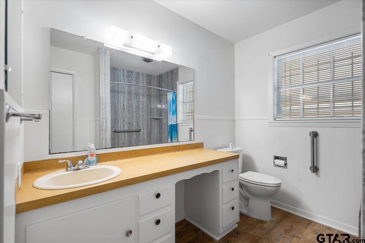 5357 Farm To Market Road 2087 Longview, TX 75603 - Photo 9 of 39 a bathroom with a sink and a mirror