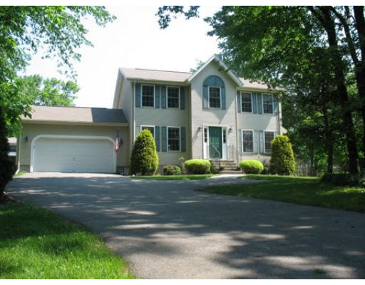 16 Country Hill Road Cumberland, RI 02864 - Photo 1 of 16 a front view of a house with garden
