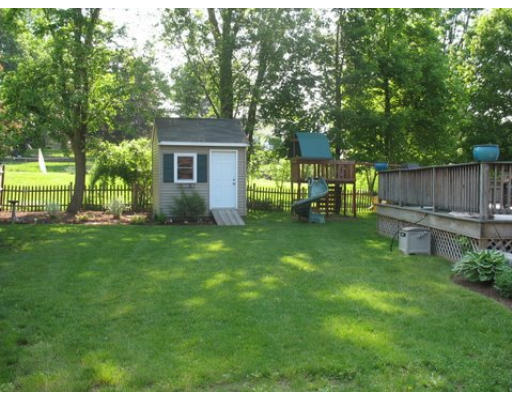 16 Country Hill Road Cumberland, RI 02864 - Photo 12 of 16 a view of backyard with table and chairs and a large tree