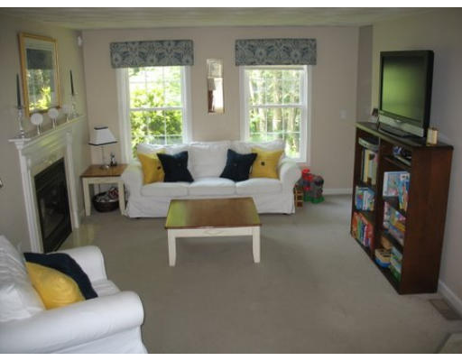 16 Country Hill Road Cumberland, RI 02864 - Photo 13 of 16 a living room with furniture and a flat screen tv