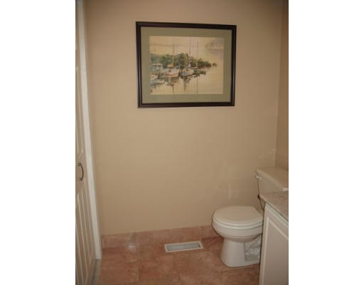 16 Country Hill Road Cumberland, RI 02864 - Photo 16 of 16 a white toilet sitting next to a white wall