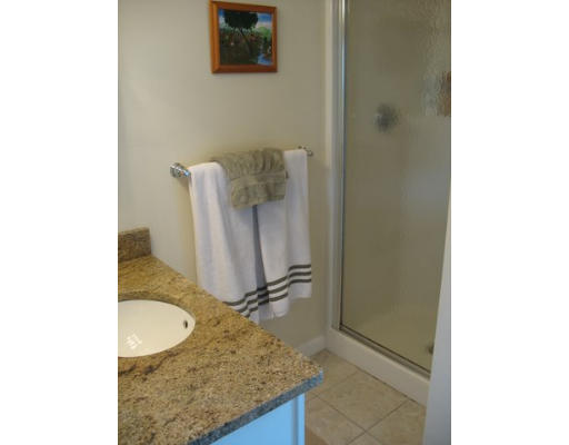 16 Country Hill Road Cumberland, RI 02864 - Photo 4 of 16 a bathroom with a granite countertop sink and a mirror