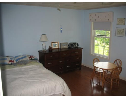 16 Country Hill Road Cumberland, RI 02864 - Photo 7 of 16 a bedroom with a bed and window