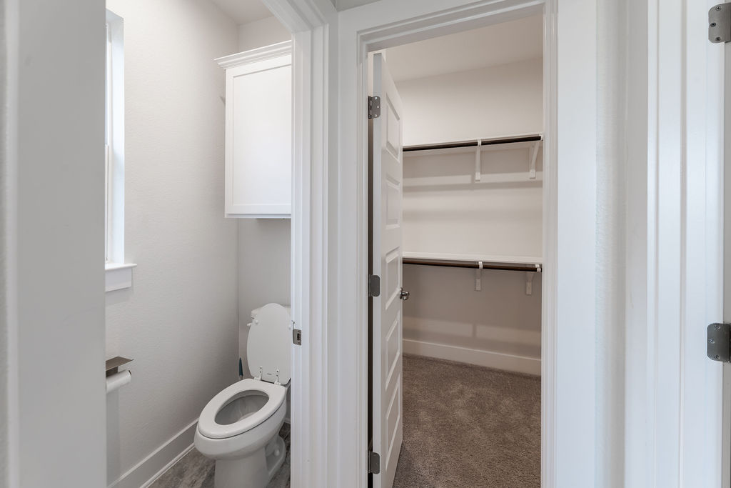 6414 Cowman Way Austin, TX 78747 - Photo 25 of 35 An organized walk-in closet sits just steps away from the private powder room.