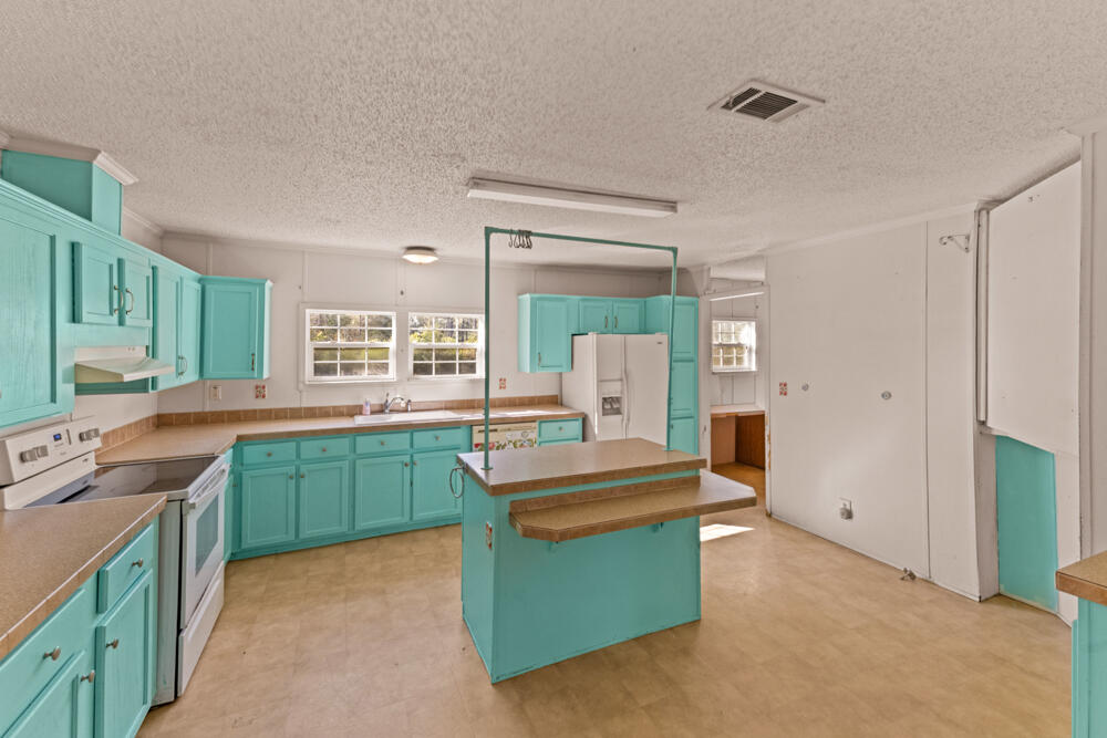 5710 US 90 Lee, FL 32059 - Photo 12 of 38 a kitchen with sink and cabinets