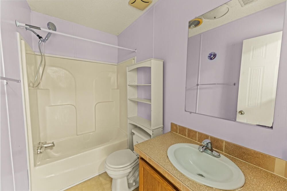 5710 US 90 Lee, FL 32059 - Photo 18 of 38 a bathroom with a sink toilet and shower