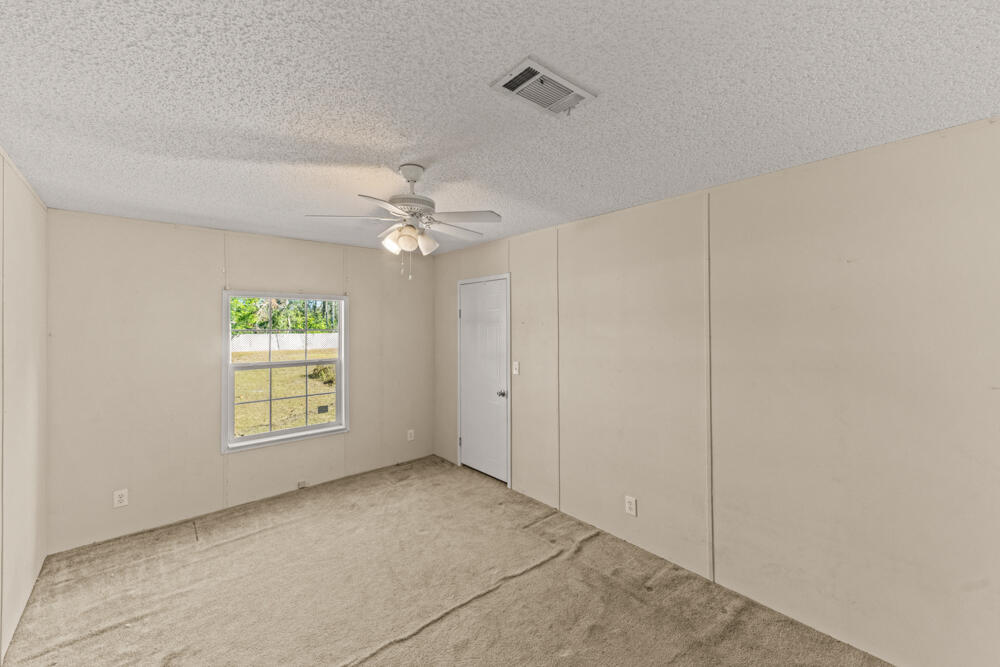 5710 US 90 Lee, FL 32059 - Photo 23 of 38 a view of an empty room with a window