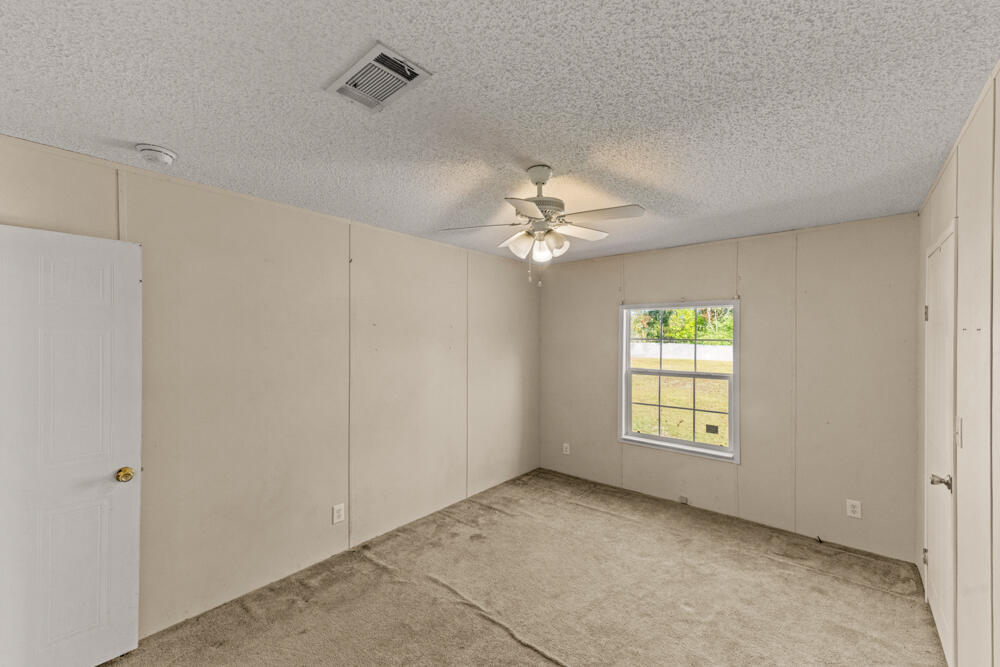 5710 US 90 Lee, FL 32059 - Photo 24 of 38 a view of an empty room with a window