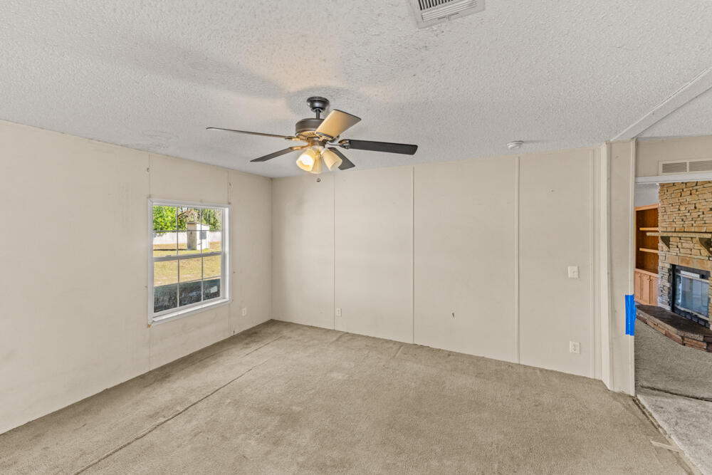 5710 US 90 Lee, FL 32059 - Photo 27 of 38 wooden floor in an empty room with a window