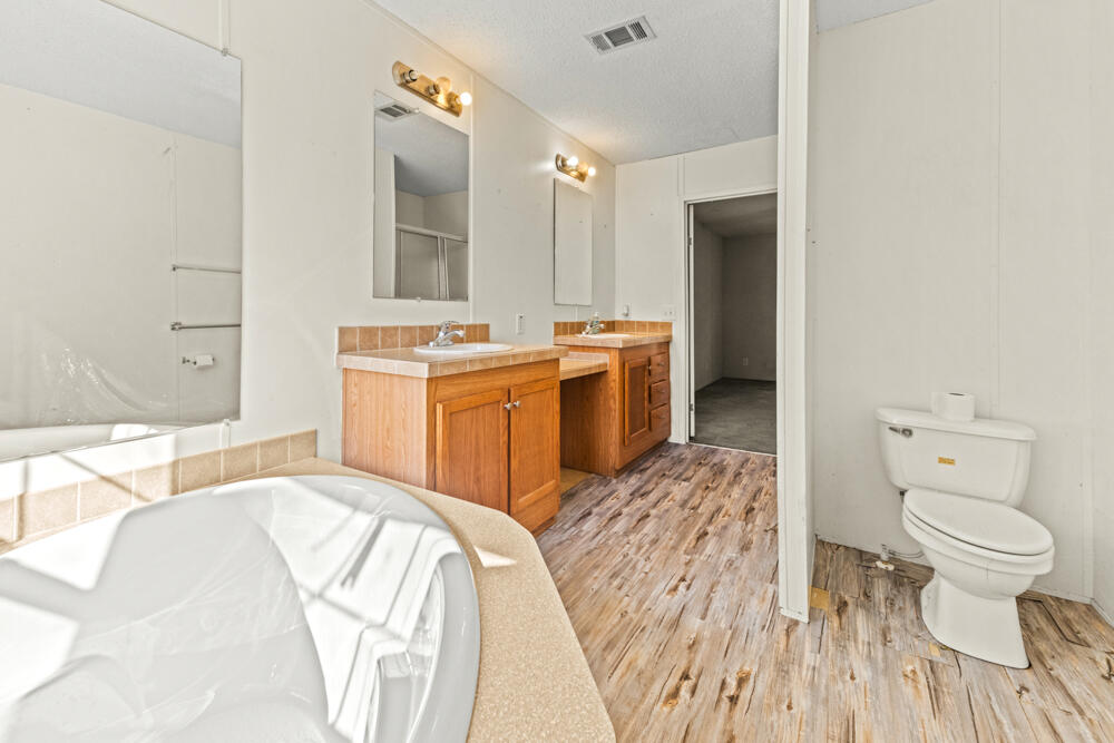5710 US 90 Lee, FL 32059 - Photo 29 of 38 a spacious bathroom with a sink and a mirror