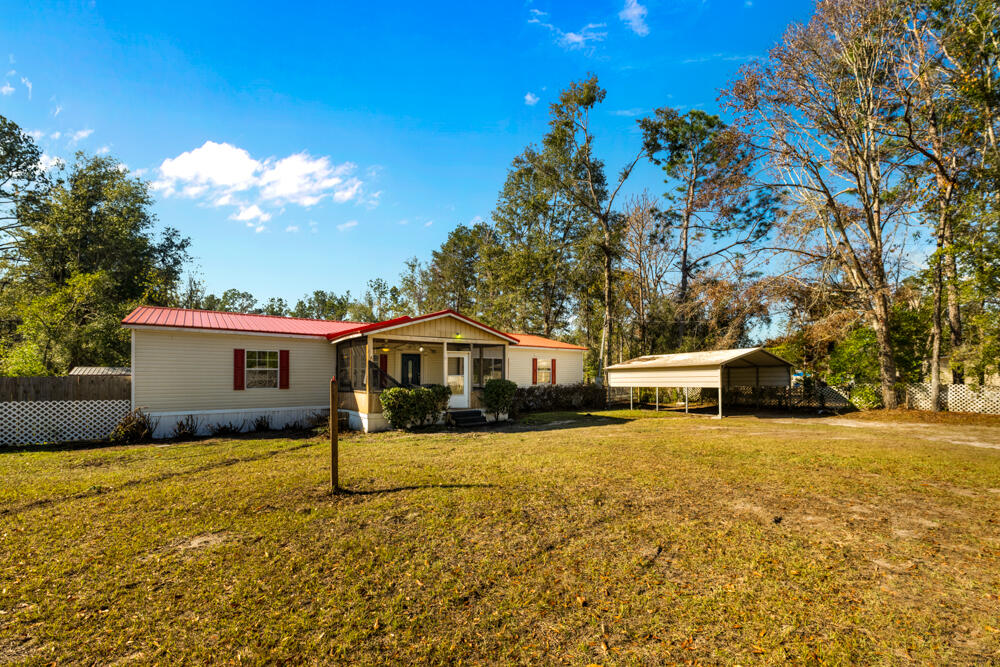 5710 US 90 Lee, FL 32059 - Photo 31 of 38 a view of a house with a yard