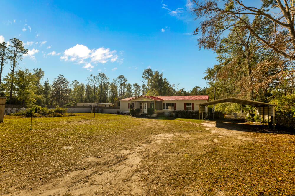 5710 US 90 Lee, FL 32059 - Photo 32 of 38 a view of a house with a yard