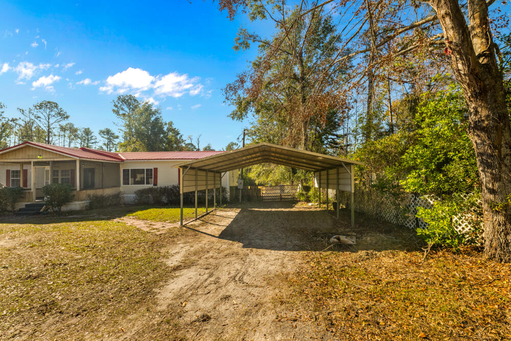 5710 US 90 Lee, FL 32059 - Photo 33 of 38 a front view of a house with a yard