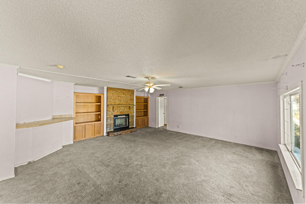5710 US 90 Lee, FL 32059 - Photo 6 of 38 an empty room with a empty space and windows
