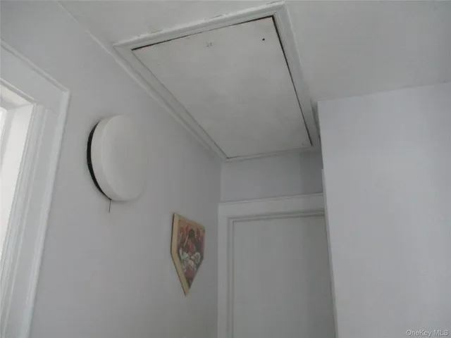 a bathroom with a shower and a mirror