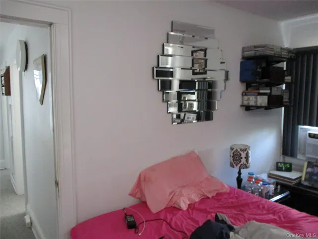 a bedroom with a bed and cabinets